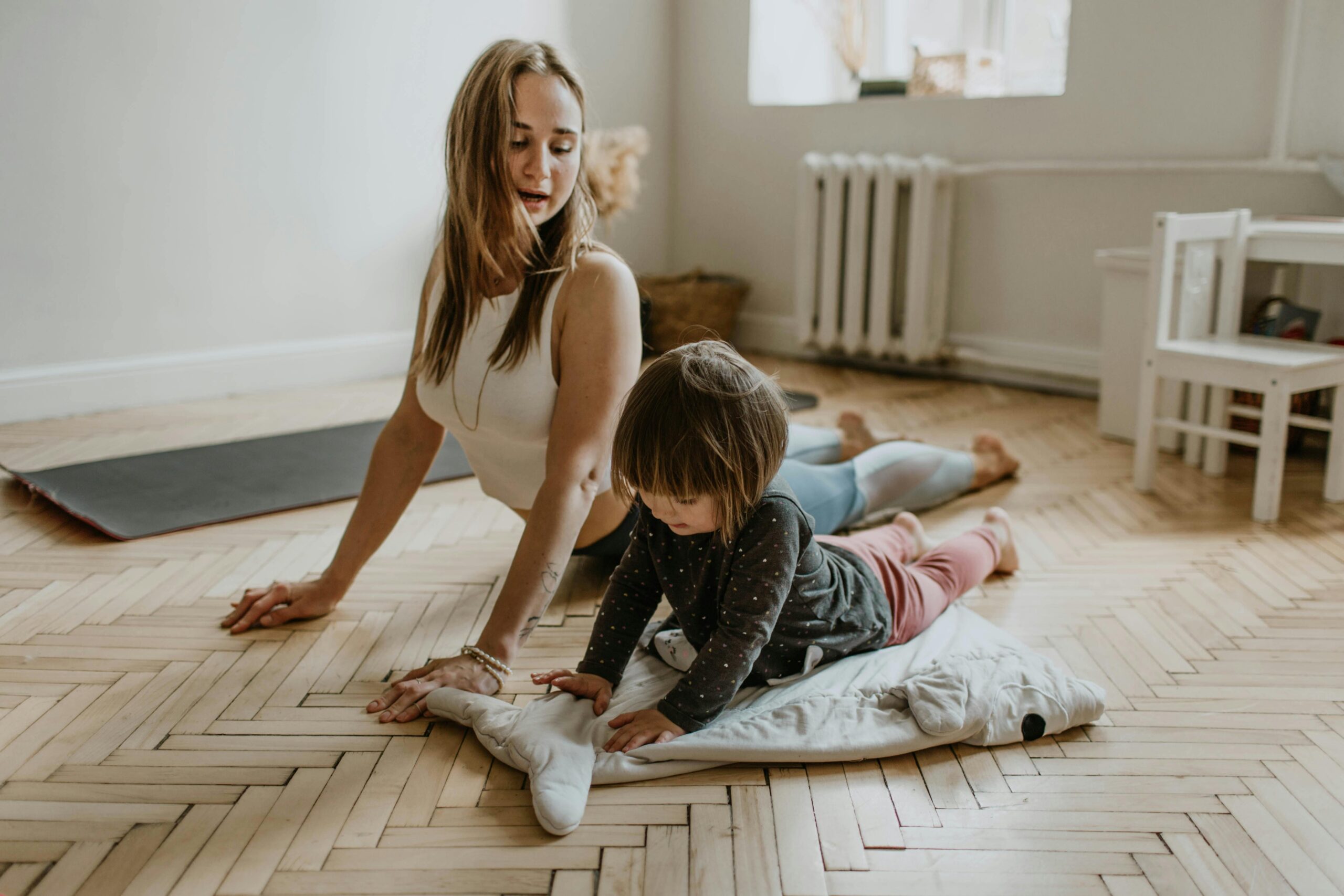 a mother doing yoga with her child